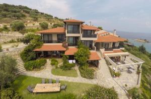 an aerial view of a house on a hill at Thalassokipos in Vourvourou