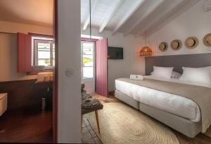 En eller flere senge i et værelse på Herdade Do Touril