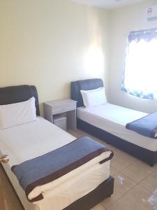 Postel nebo postele na pokoji v ubytování Maha Hotel