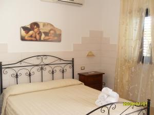 A bed or beds in a room at Perla del Salento