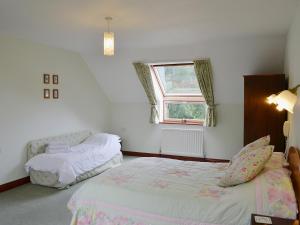 A bed or beds in a room at The Chestnuts 