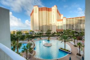 a view of a resort with a large swimming pool at Laketown Wharf Resort 1036 By Aneliya in Panama City Beach