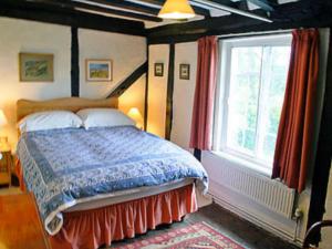 A bed or beds in a room at Watsons Farm 