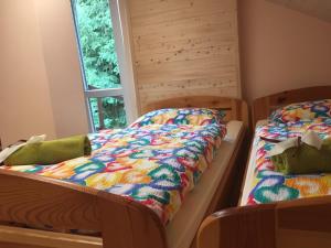 Un pat sau paturi într-o cameră la Penzion Kunvald Končiny