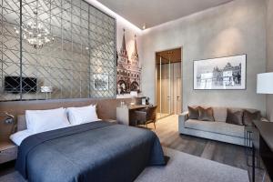 a bedroom with a bed and a living room at PR Myasnitsky Boutique Hotel in Moscow