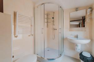 a bathroom with a shower and a toilet and a sink at Willa Tina in Karwia +64 photos