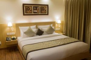 Postel nebo postele na pokoji v ubytování Hotel Regent Grand