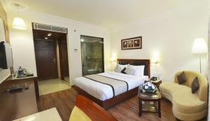 Postel nebo postele na pokoji v ubytování Hotel Regent Grand