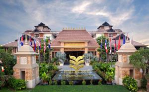 a large building with a fountain in front of it at Angkor Miracle Resort & Spa in Siem Reap