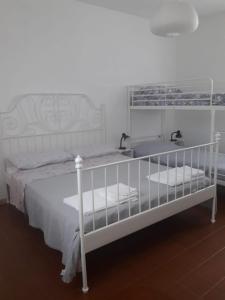Кровать или кровати в номере Pecore Ribelli