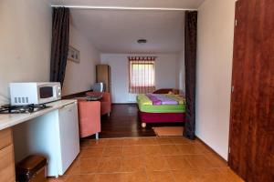 A bed or beds in a room at Apartmánový dom RED