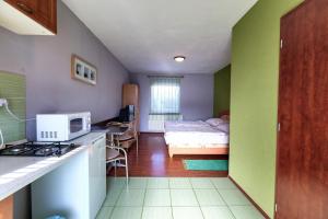 A bed or beds in a room at Apartmánový dom RED