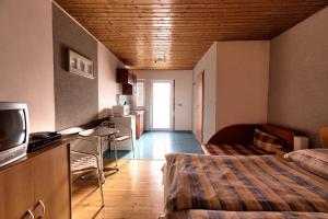 A bed or beds in a room at Apartmánový dom RED