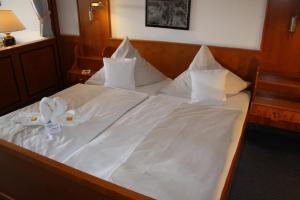 Postel nebo postele na pokoji v ubytování Hotel Friesengeist