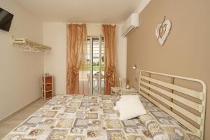 Postel nebo postele na pokoji v ubytování Quarantotto B&B