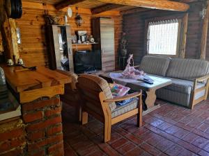 a living room with a couch and a table at Katarina Doboj,Bušletić in Busletić