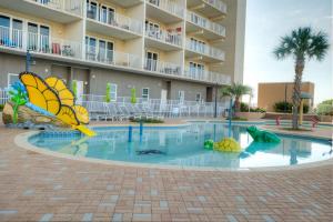 a pool at a resort with a butterfly fountain at Laketown Wharf Resort 416 By Aneliya in Panama City Beach