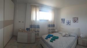 Postel nebo postele na pokoji v ubytování Casa Vacanze Lungomare