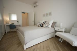 Ένα ή περισσότερα κρεβάτια σε δωμάτιο στο Le Casette di Marcì