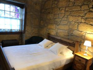 Säng eller sängar i ett rum på Quinta da Portela - Casa Visconde Arneiros