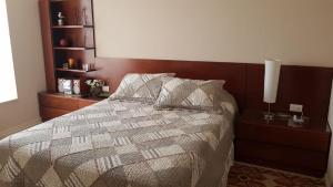Een bed of bedden in een kamer bij Laguna Bahía Algarrobo