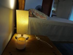 a lamp is on in a dimly lit room at Cabañas La Isla Chacahua in Guayabas