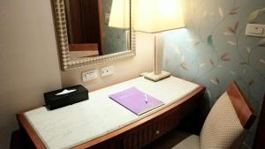 Postel nebo postele na pokoji v ubytování Elegance Hotel