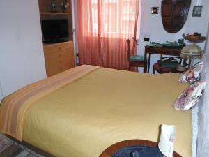 Postel nebo postele na pokoji v ubytování B&B Villa Olmo