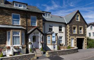a house in the middle of a street at Thornbank House Offering Breakfast and with the use of Free Local Health Club in Windermere