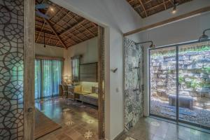 a bathroom with a walk in shower and a sink at Sailing Club Resort Mui Ne in Mui Ne +78 photos