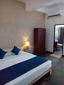 Postel nebo postele na pokoji v ubytování Hotel Star White - Negombo