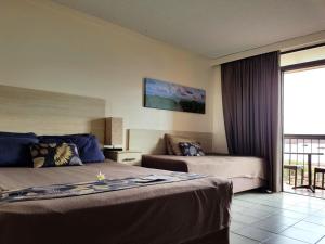 Ένα ή περισσότερα κρεβάτια σε δωμάτιο στο Dampier Mermaid Hotel Karratha