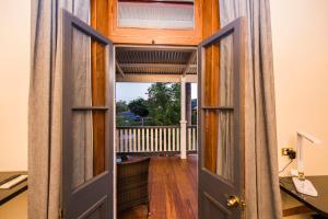 an open door with a view of a porch at The Parkview Hotel Mudgee in Mudgee