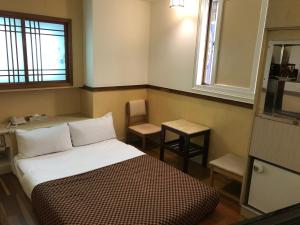 Ein Bett oder Betten in einem Zimmer der Unterkunft 真正好旅店 Good Hotel