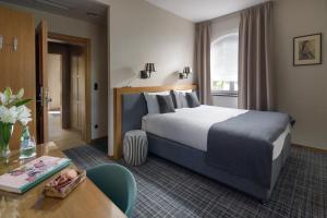 Łóżko lub łóżka w pokoju w obiekcie Relais & Châteaux Hotel Quadrille - Adults Only