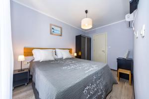 a bedroom with a large bed in a room at Ema 2BR apt. in old town centre in Zadar