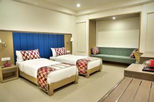 Purple Cloud Hotel客房内的一张或多张床位