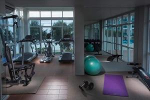 a gym with exercise equipment and a large window at GrandBlue Condominium 201 in Mae Pim