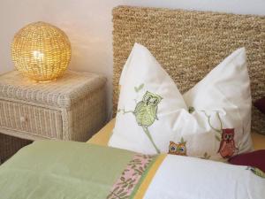 a bedroom with two pillows with owls on it at Apartment - Haus Luna (Objekt 57207) in Dresden