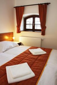 Letto o letti in una camera di Hotel Pod Sluncem