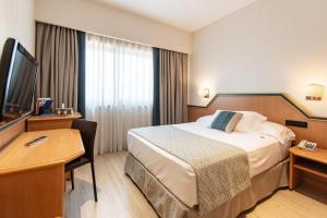 Postel nebo postele na pokoji v ubytování Hotel Praga