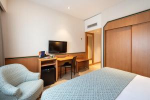 TV a/nebo společenská místnost v ubytování Hotel Praga