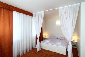 Letto o letti in una camera di Hotel Pod Sluncem
