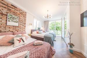 Posteľ alebo postele v izbe v ubytovaní Family Luxury Pure Old Town Apartament 1-8, 2 sypialnie i salon, parking pub, 60m2
