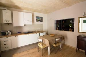 Kuchyň nebo kuchyňský kout v ubytování Casa Sassi Vizziello