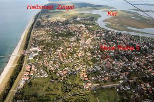 an aerial view of a city next to the water at Ferienhaus im urigen Garten bzw Eulenhaus in Zingst