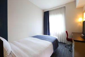 Postel nebo postele na pokoji v ubytování Hotel Hokke Club Oita + 45 fotografií