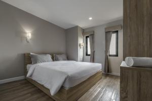 Carnation Residence客房内的一张或多张床位
