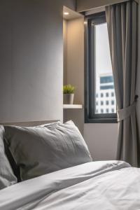 Carnation Residence客房内的一张或多张床位