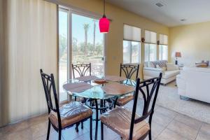 a dining room with a table and chairs at Paradise in Indian Palm Country Club Permit# 50103 in Indio